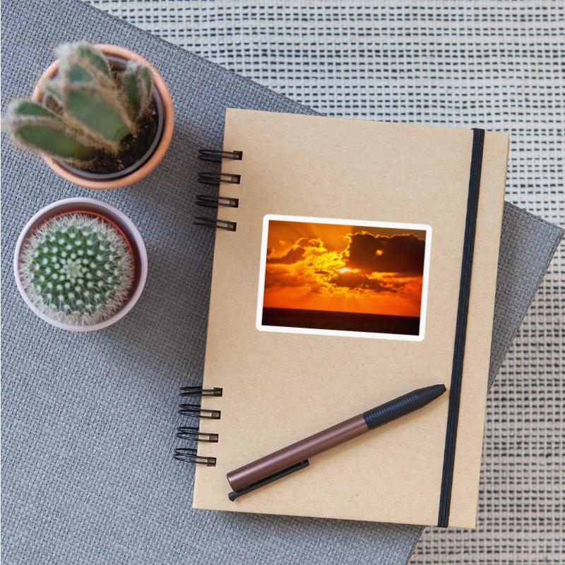 brilliant shining sun behind clouds rises