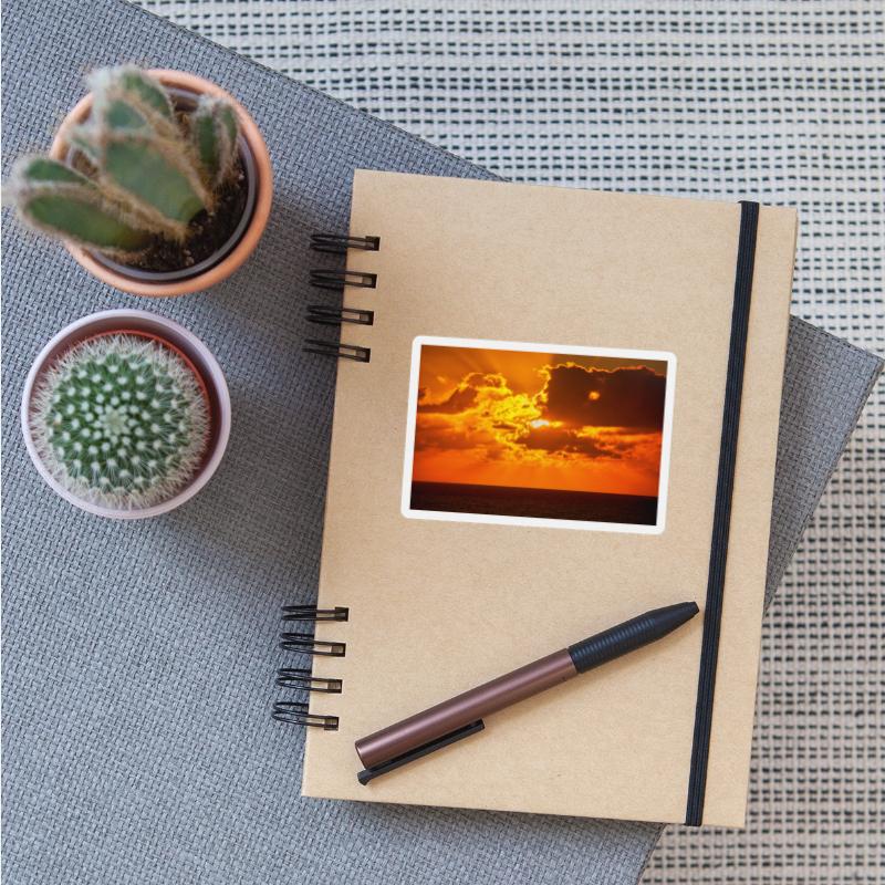 brilliant shining sun behind clouds rises