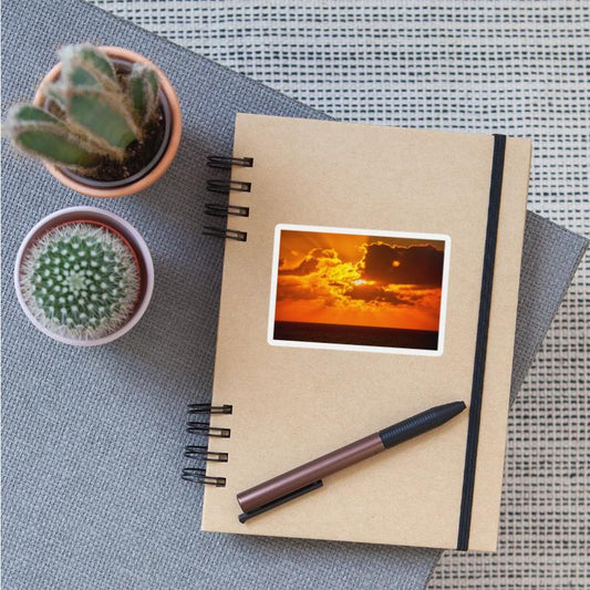 brilliant shining sun behind clouds rises